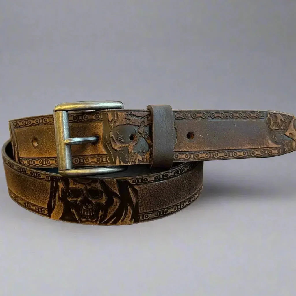 Brown grain leather men's belt with skull design and removable metal buckle.