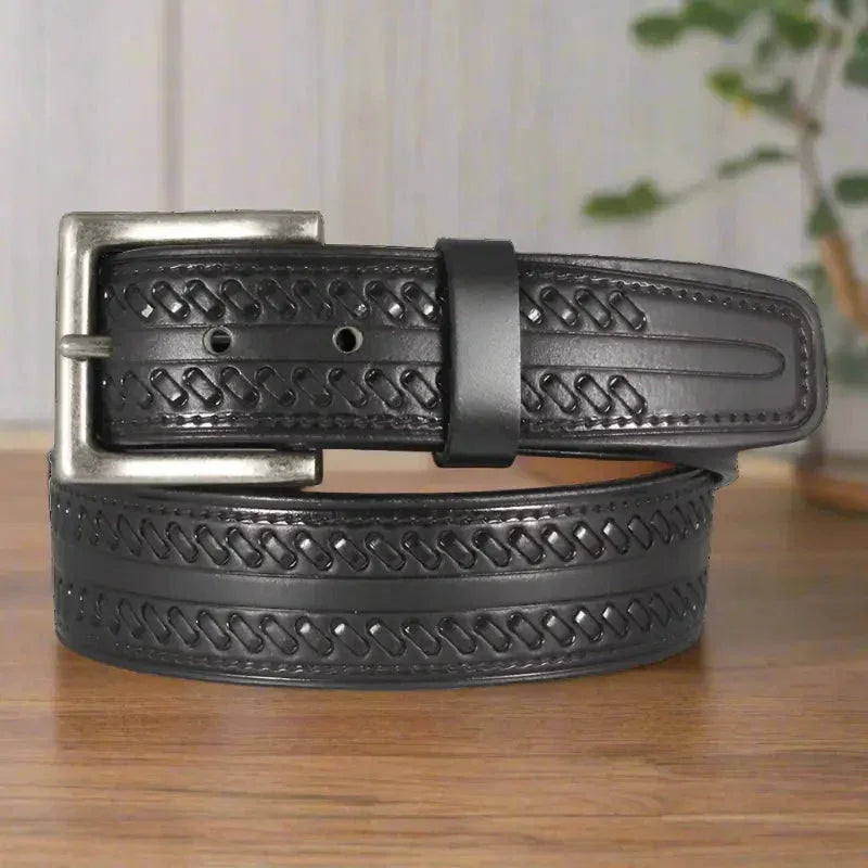Black men's tooled leather belt with whipstitch design and silver removable buckle