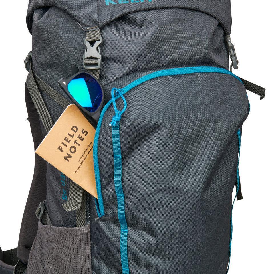 Kelty Asher 55 hiking backpack with field notes and blue sunglasses in side pocket