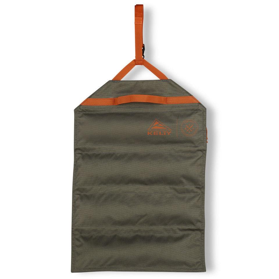 Olive green Kelty chef roll with orange straps, hanging, durable portable utensil bag