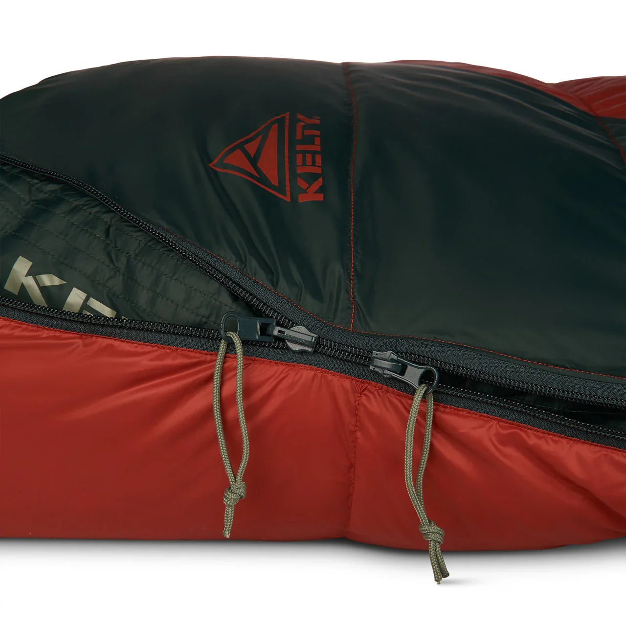 Kelty Cosmic Down sleeping bag close-up, showing red and black fabric with zippers