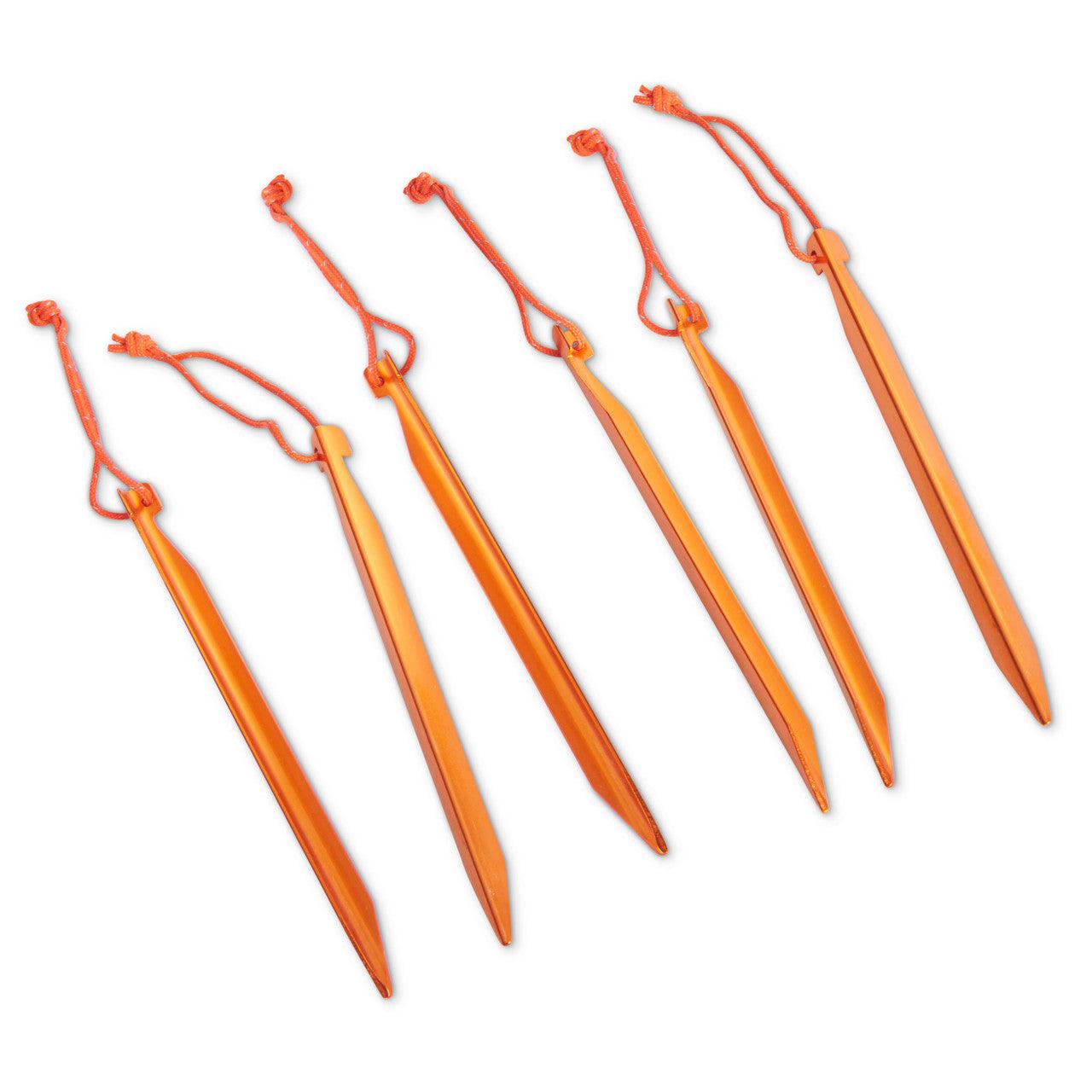 Set of five orange aluminum tent stakes with attached cords on a white background