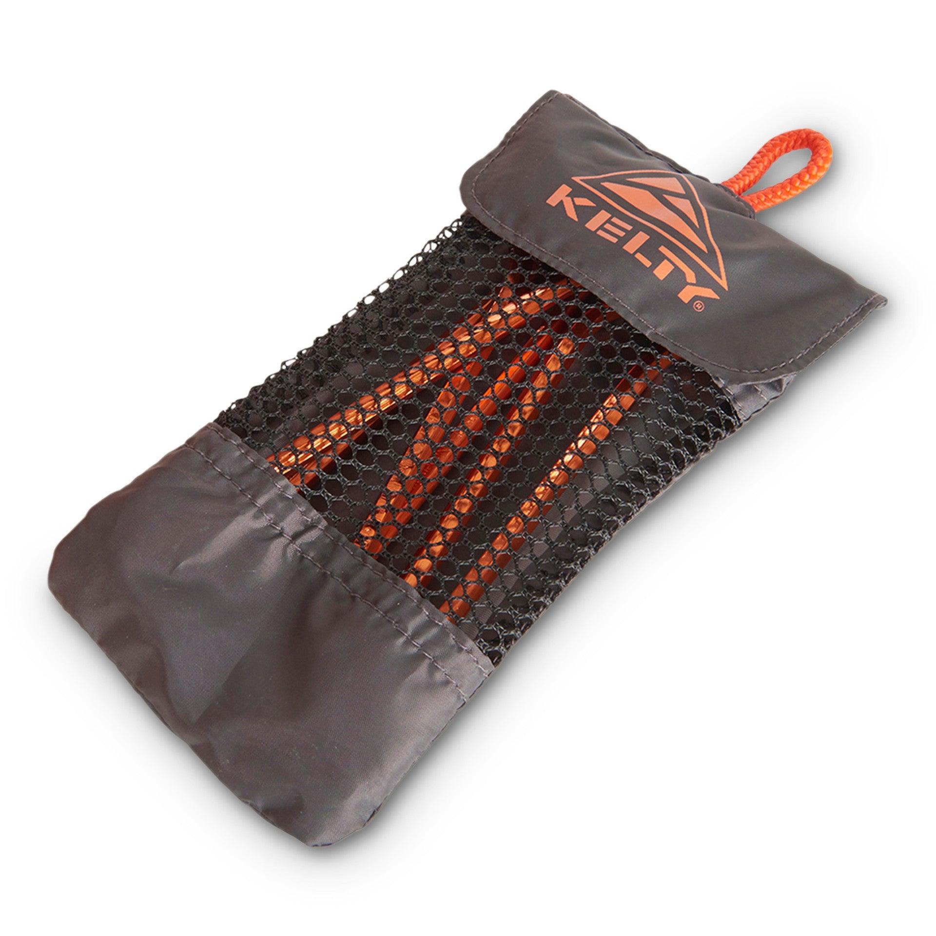 Kelty orange reflective tent stakes in black mesh storage pouch