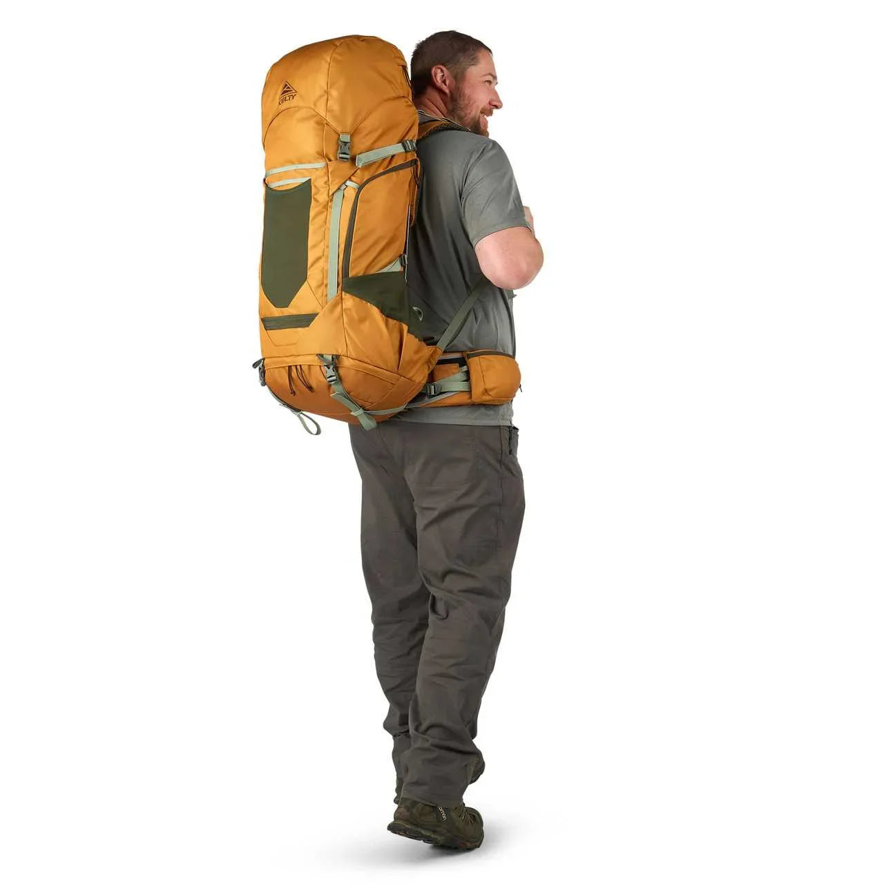 Man wearing a large orange Kelty Glendale 65L backpack, outdoor gear, white background