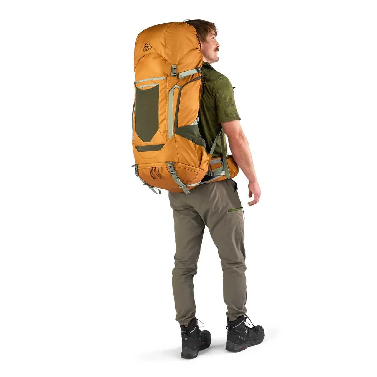 Man wearing Kelty Glendale 65L orange hiking backpack with green accents on white background