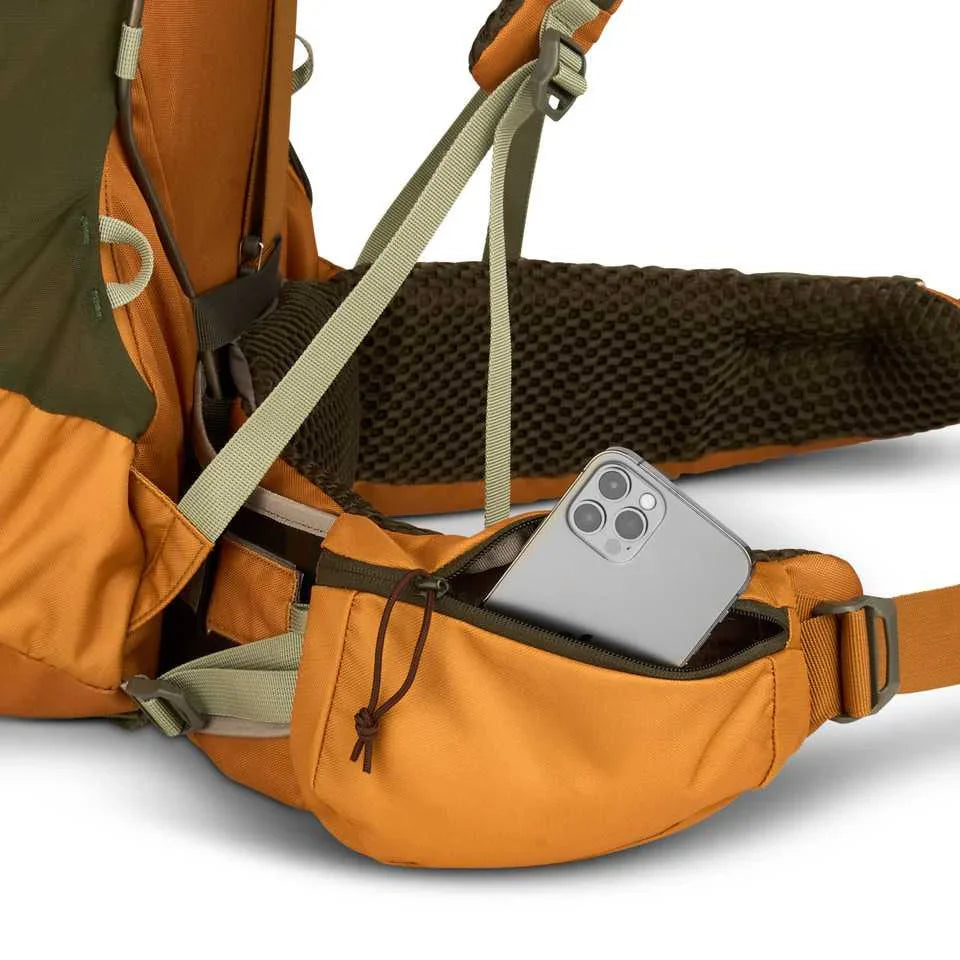 Kelty Glendale 65L orange hiking backpack hip belt pocket holding a smartphone