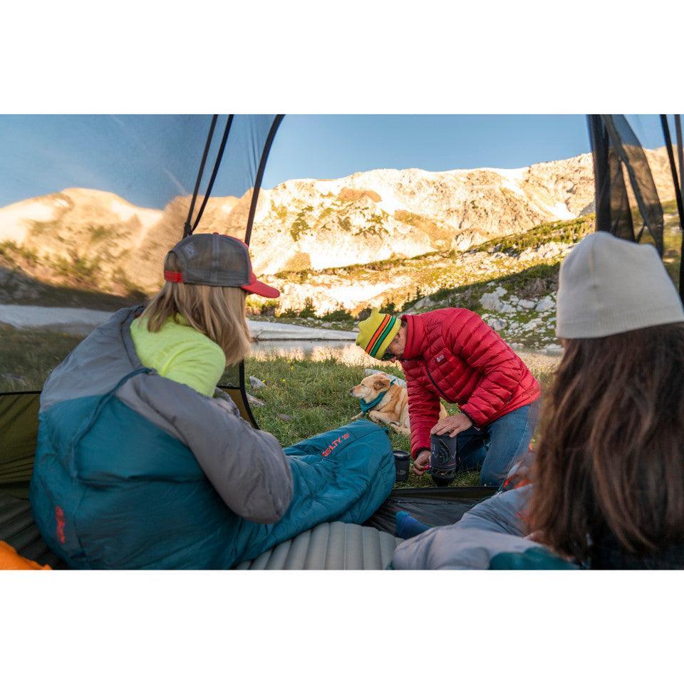 Campers in Kelty Grand Mesa 2 backpacking tent with dog, mountain scenery in background