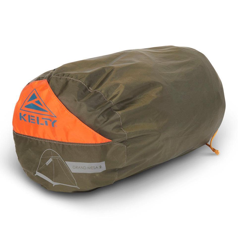 Kelty Grand Mesa 2 backpacking tent packed in olive green and orange carry bag