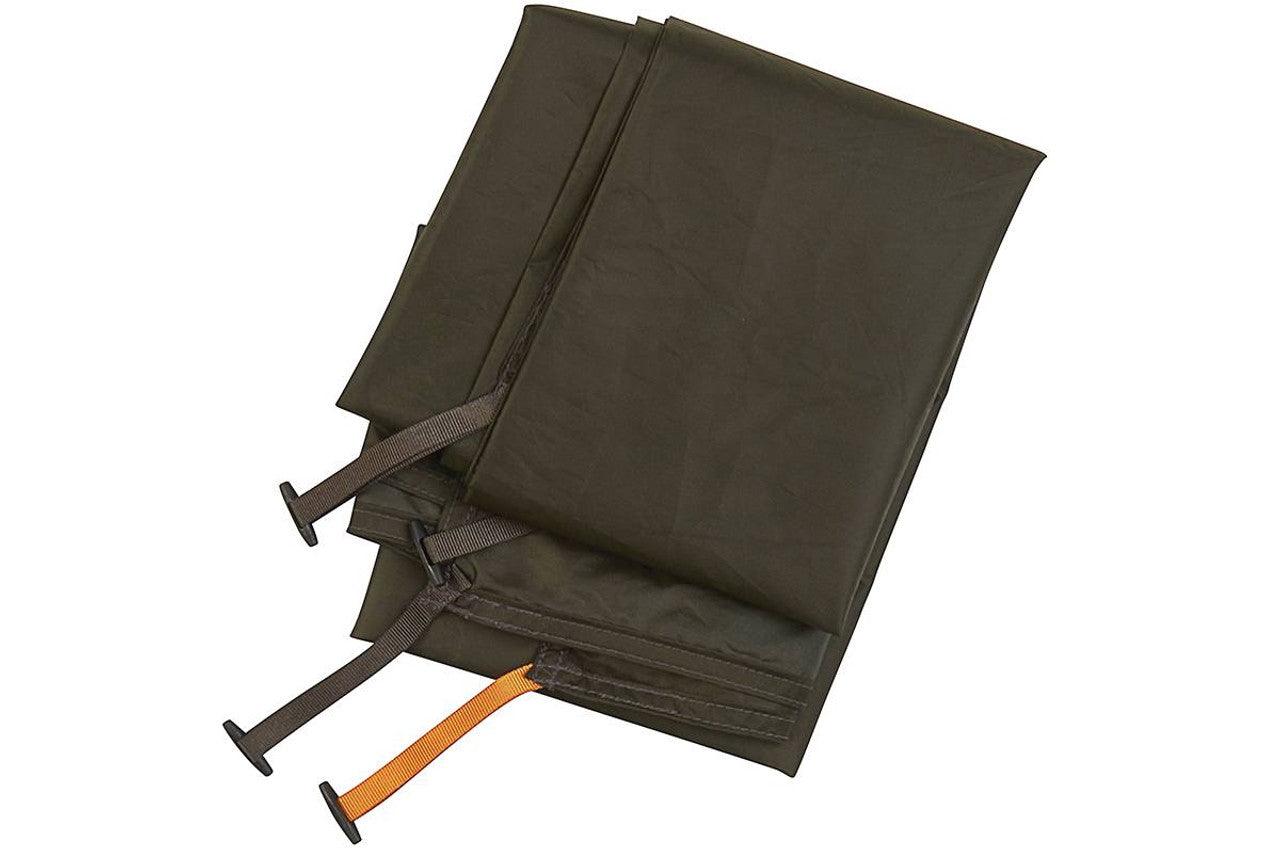 Folded dark green tent footprint with straps for camping gear protection
