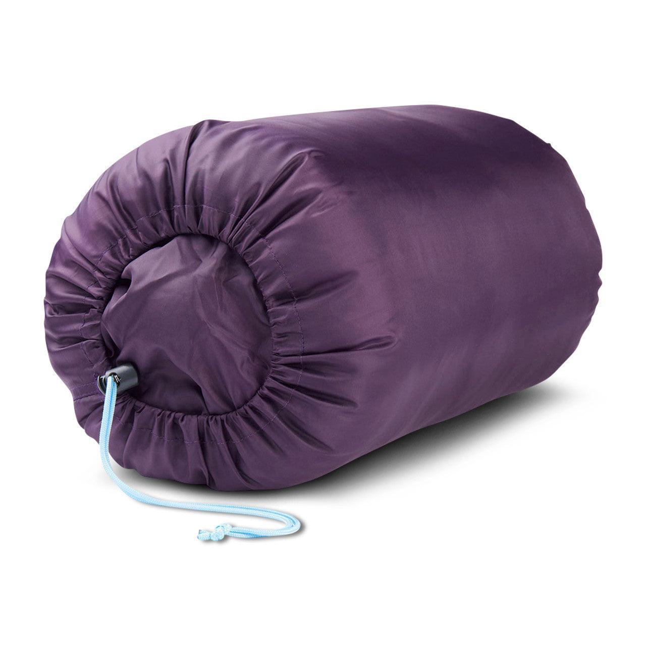 Purple kids camping sleeping bag rolled in stuff sack with blue drawstring