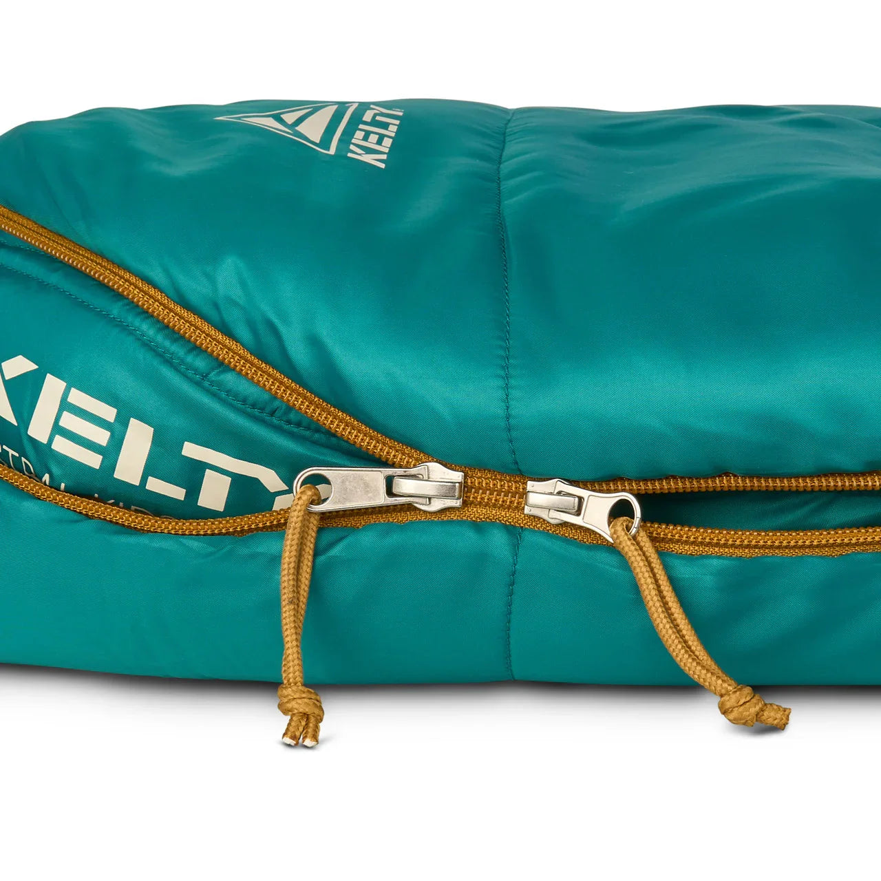 Kelty teal kids sleeping bag with yellow zipper and logo detail, close-up view