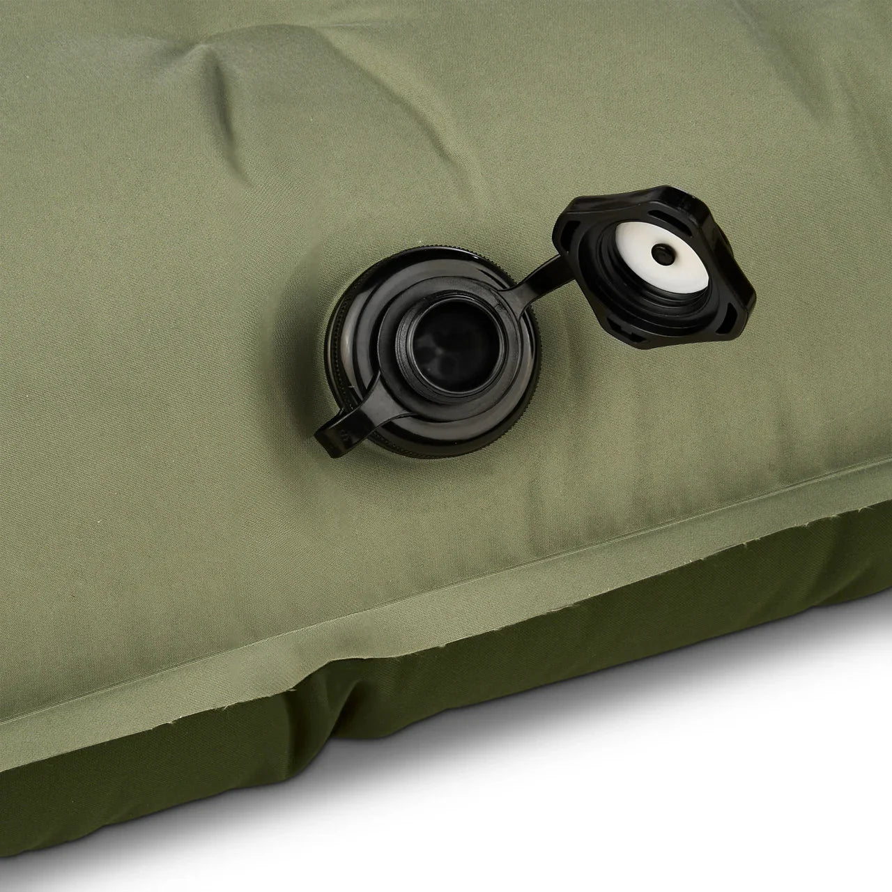 Close-up of green inflatable air mattress with open black valve cap