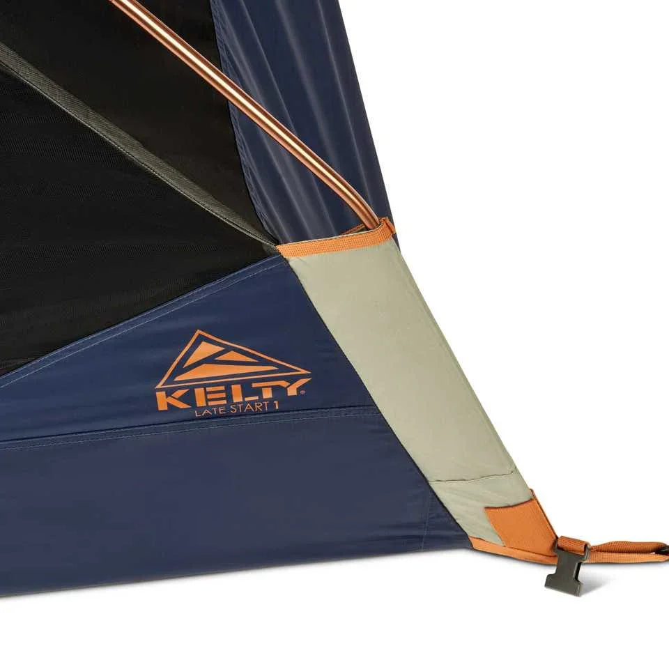 Kelty Late Start 1P tent corner detail with logo, blue and orange fabric, and pole attachment