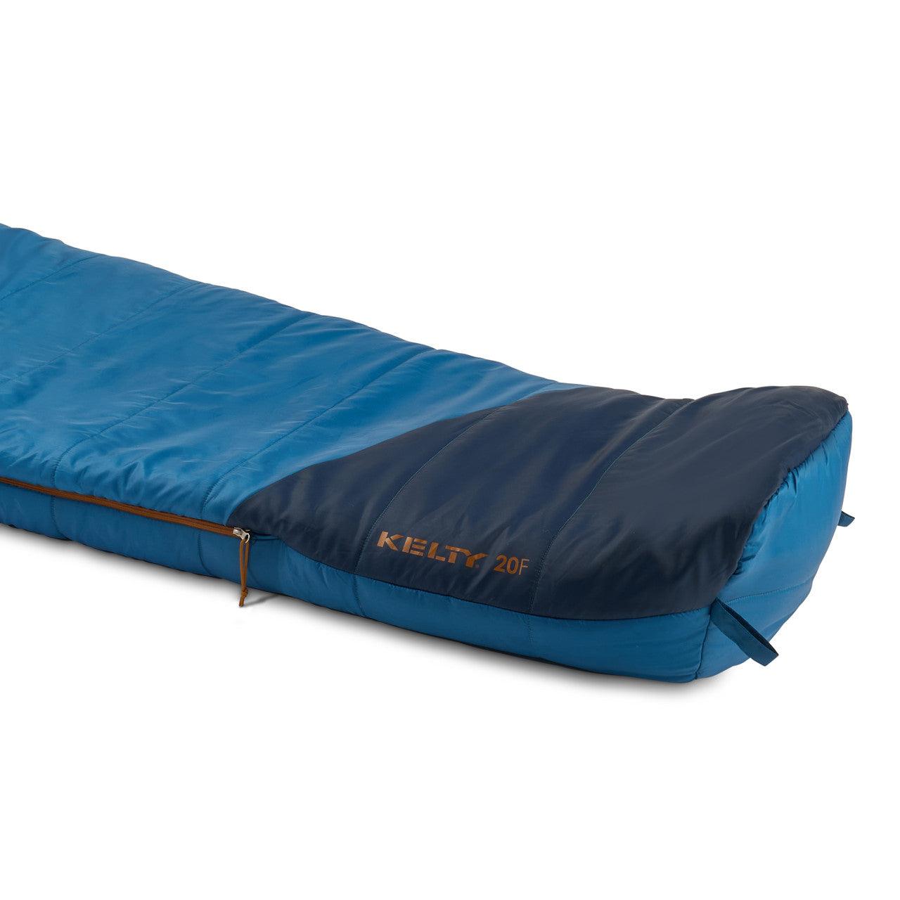 Blue Kelty 20F sleeping bag for camping with zip closure on white background