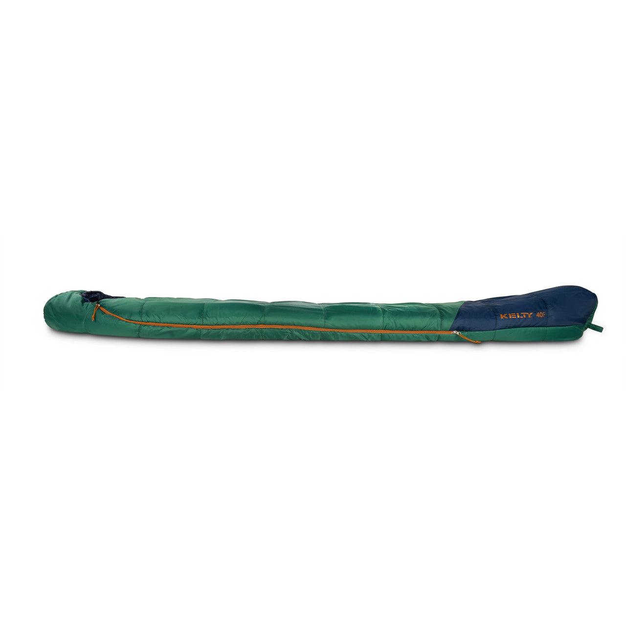 Green and blue Kelty mummy sleeping bag for camping on a white background