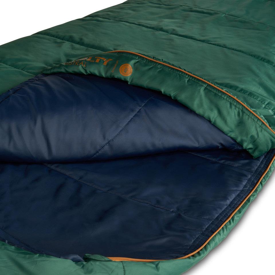 Green insulated sleeping bag with navy interior and orange zipper, camping gear