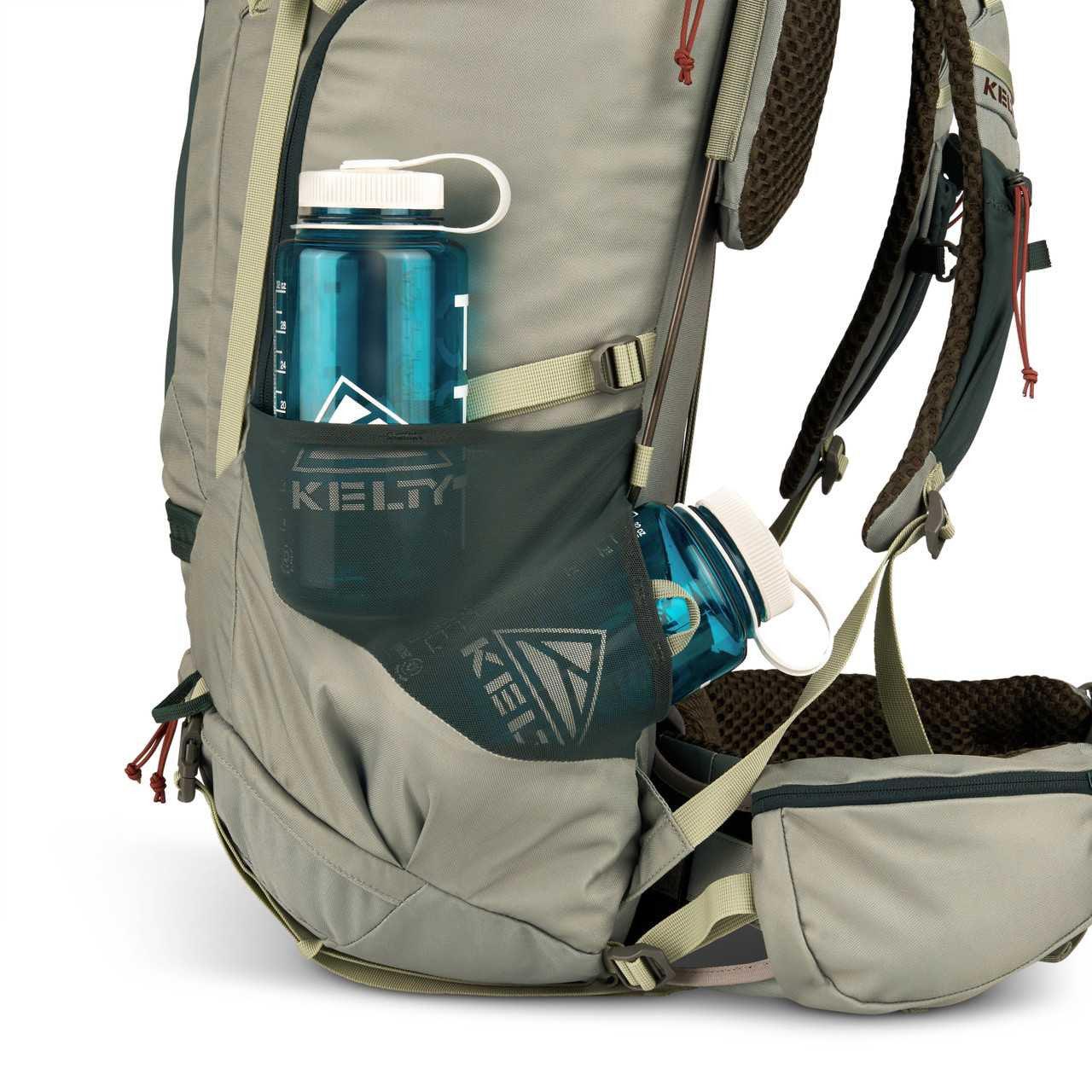 Kelty Women's Glendale 65L backpack in gray with two blue water bottles in side mesh pockets