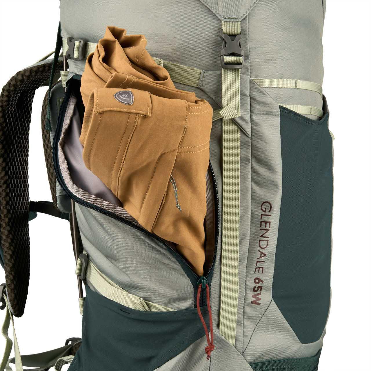 Kelty Glendale 65W women’s backpack with tan pants in side zip pocket