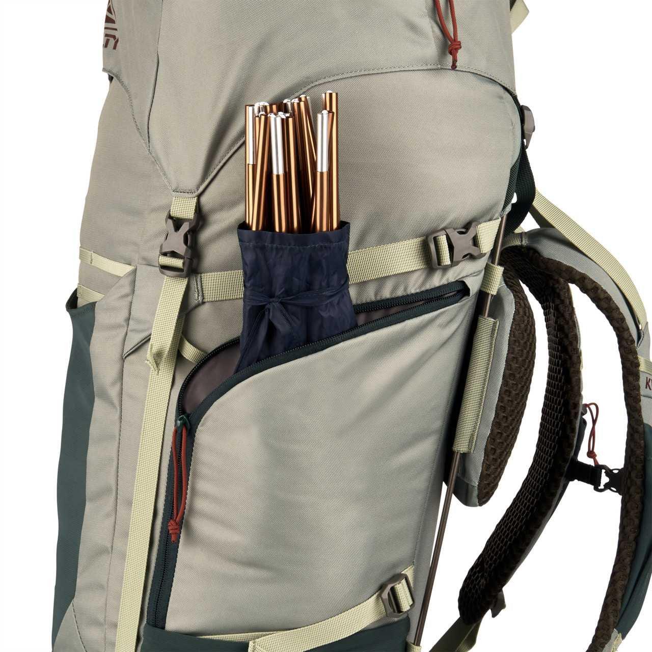 Kelty women's Glendale 65L backpack side view with gear poles in side pocket