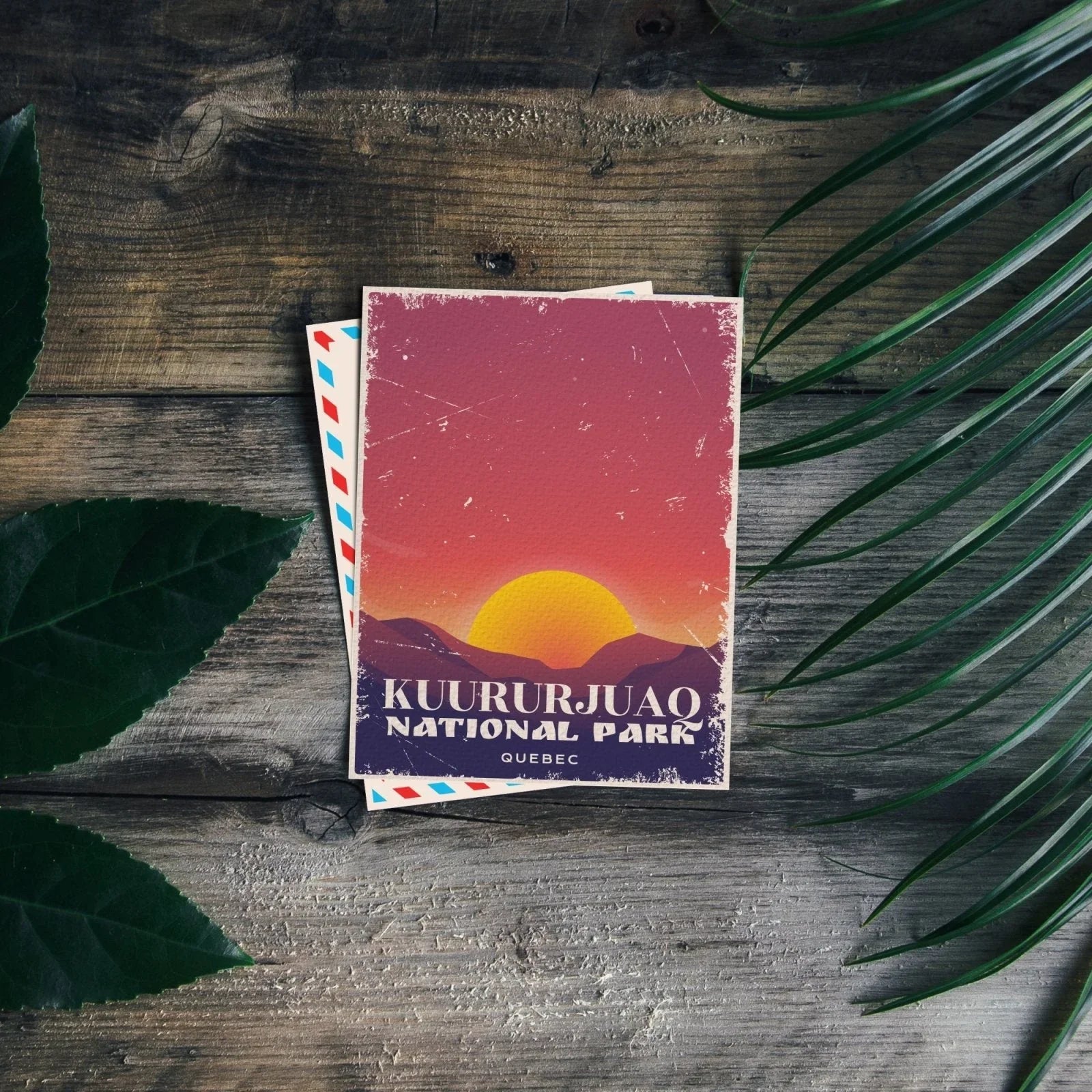 Kuururjuaq National Park Quebec postcard on rustic wood with leaves and sunset illustration