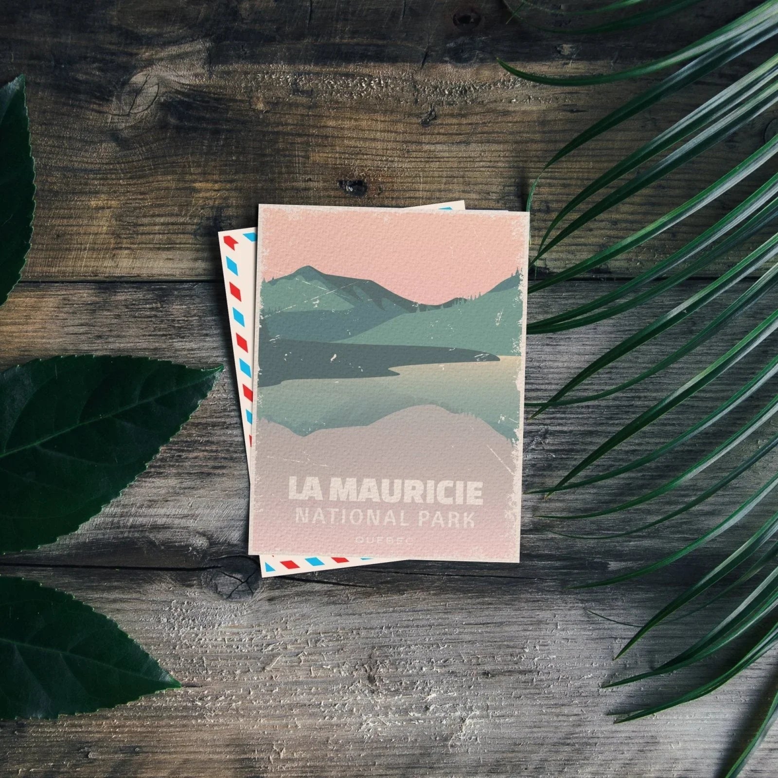 La Mauricie National Park postcard with pastel mountain and lake illustration on rustic wood table