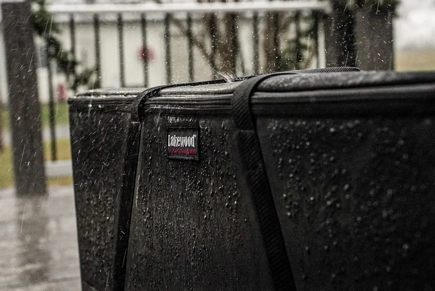 Lakewood waterproof case in heavy rain on outdoor deck