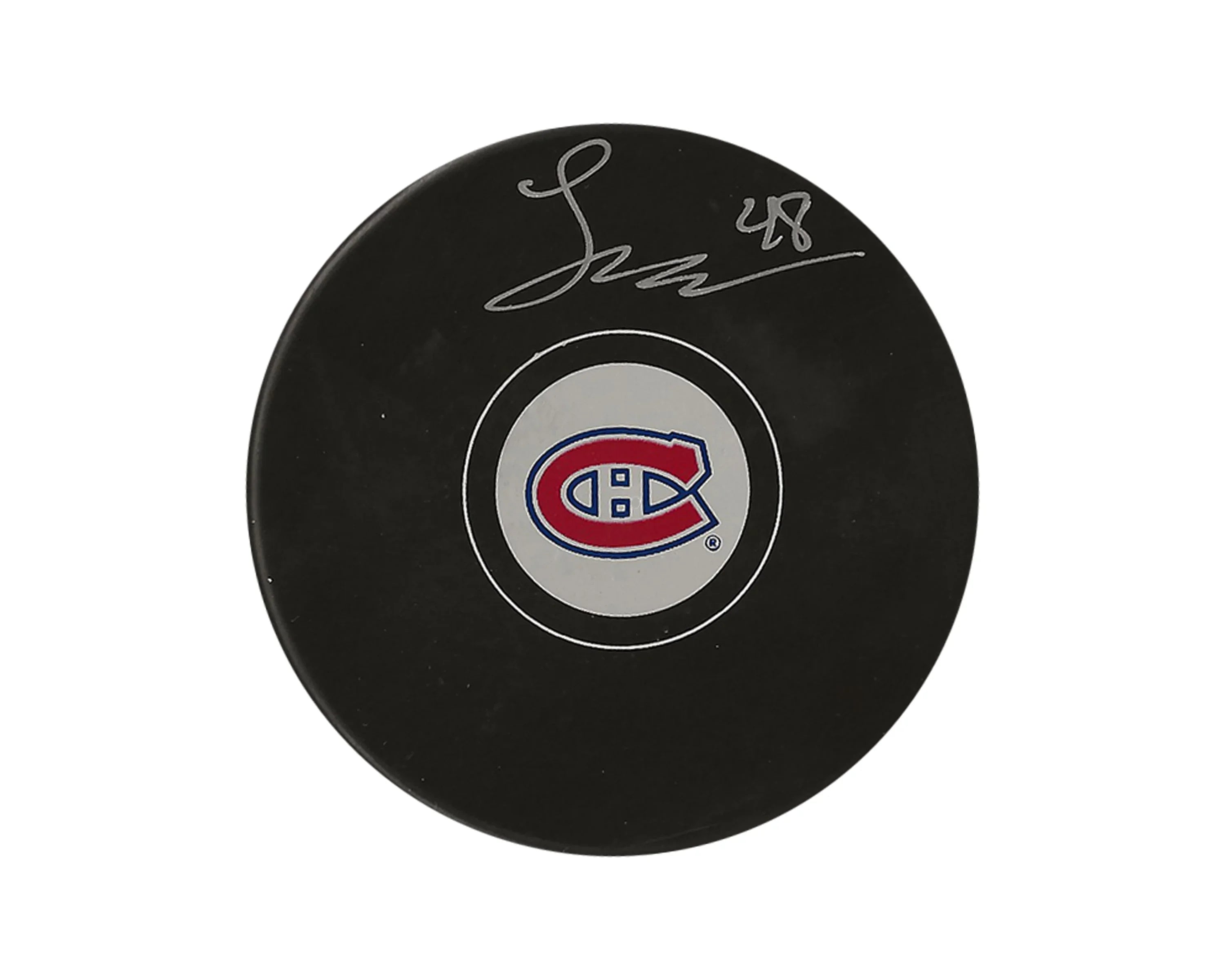 Signed Montreal Canadiens logo hockey puck on white background