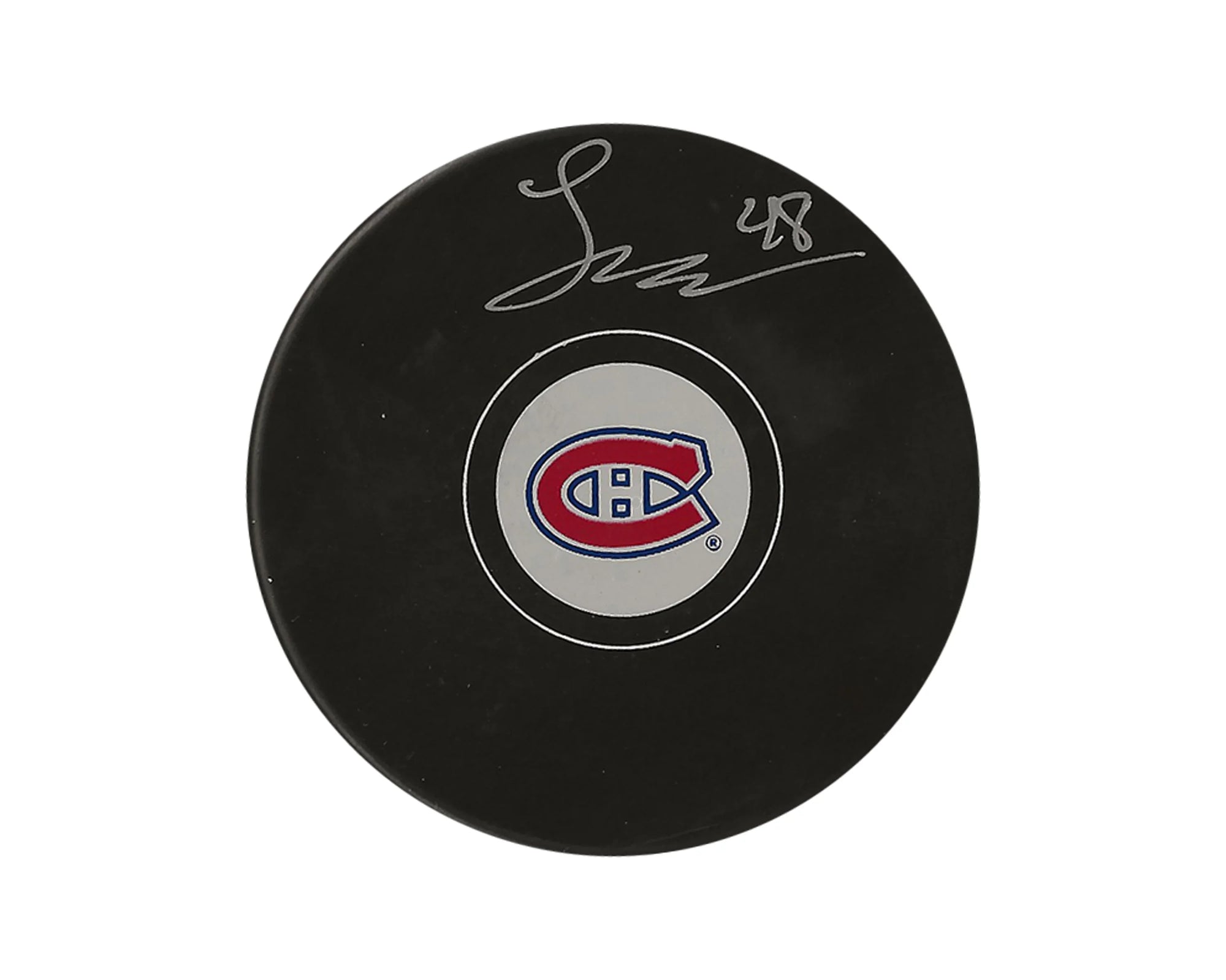Signed Montreal Canadiens logo hockey puck on white background