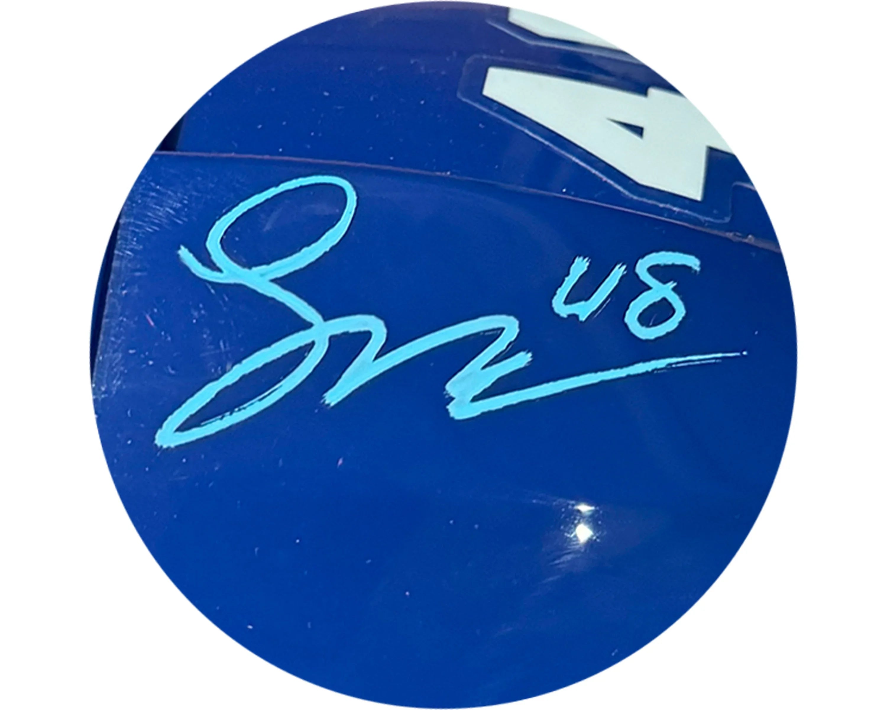 Blue helmet with white number 48 and turquoise autograph on glossy surface