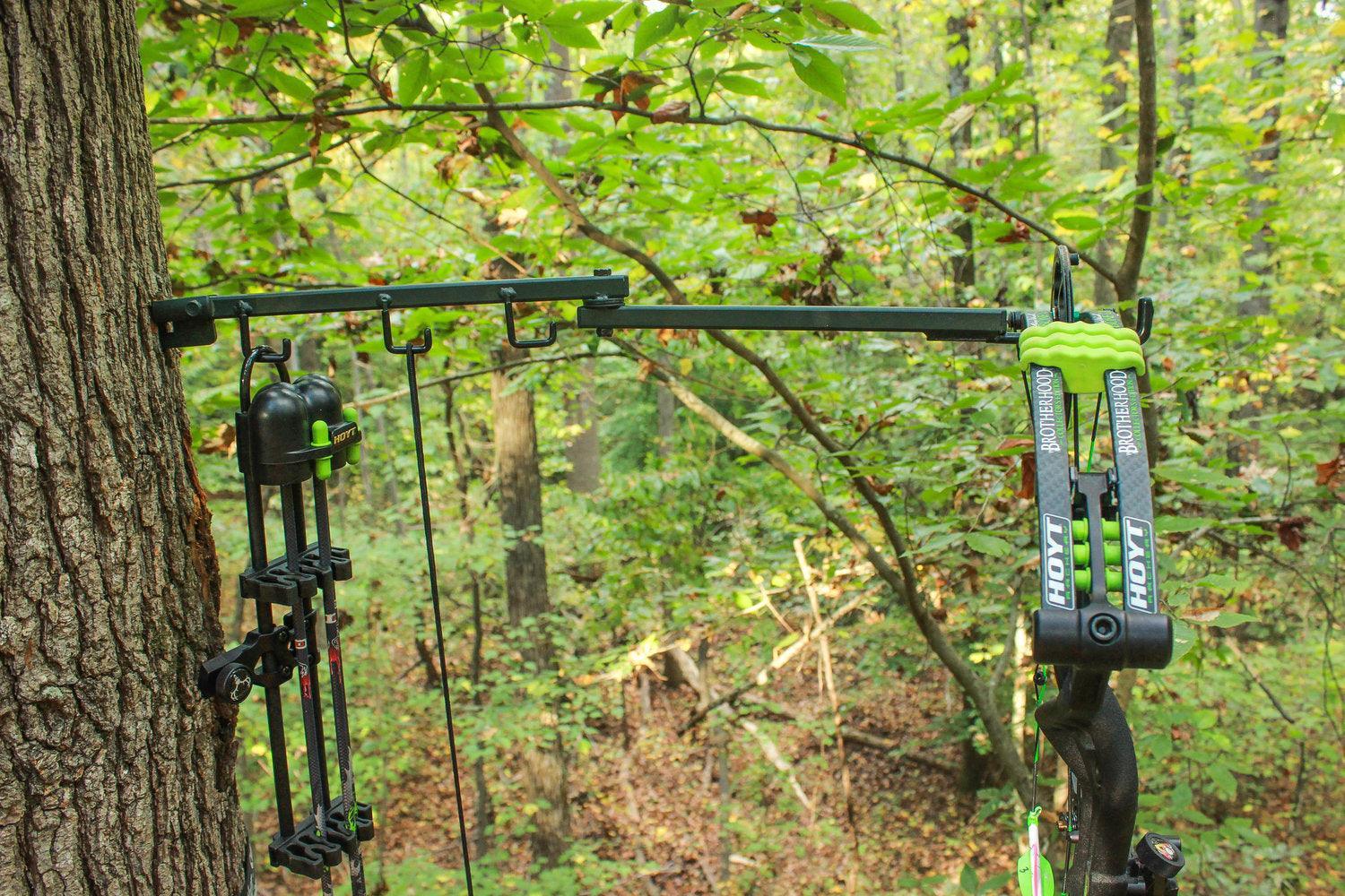 Last Chance Archery Power Lock Pro bow hanger mounted on tree holding compound bow in forest