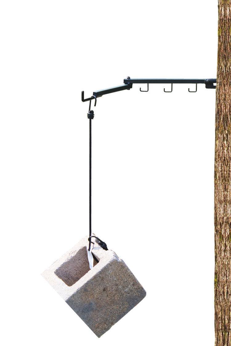 Last Chance Archery Power Lock Pro bow hanger mounted on tree, holding cinder block for strength test