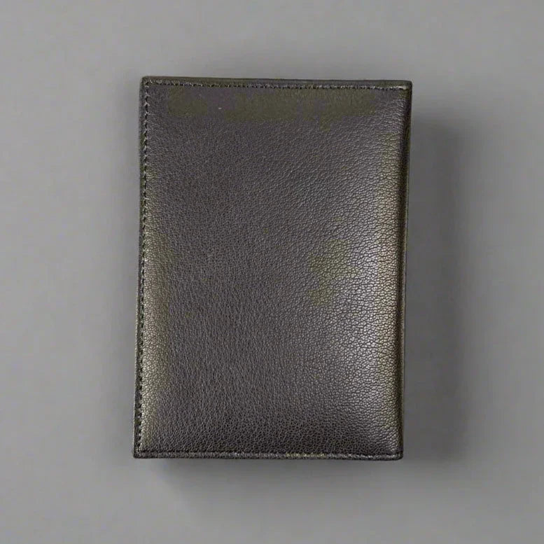 Closed dark brown leather wallet on a plain gray background