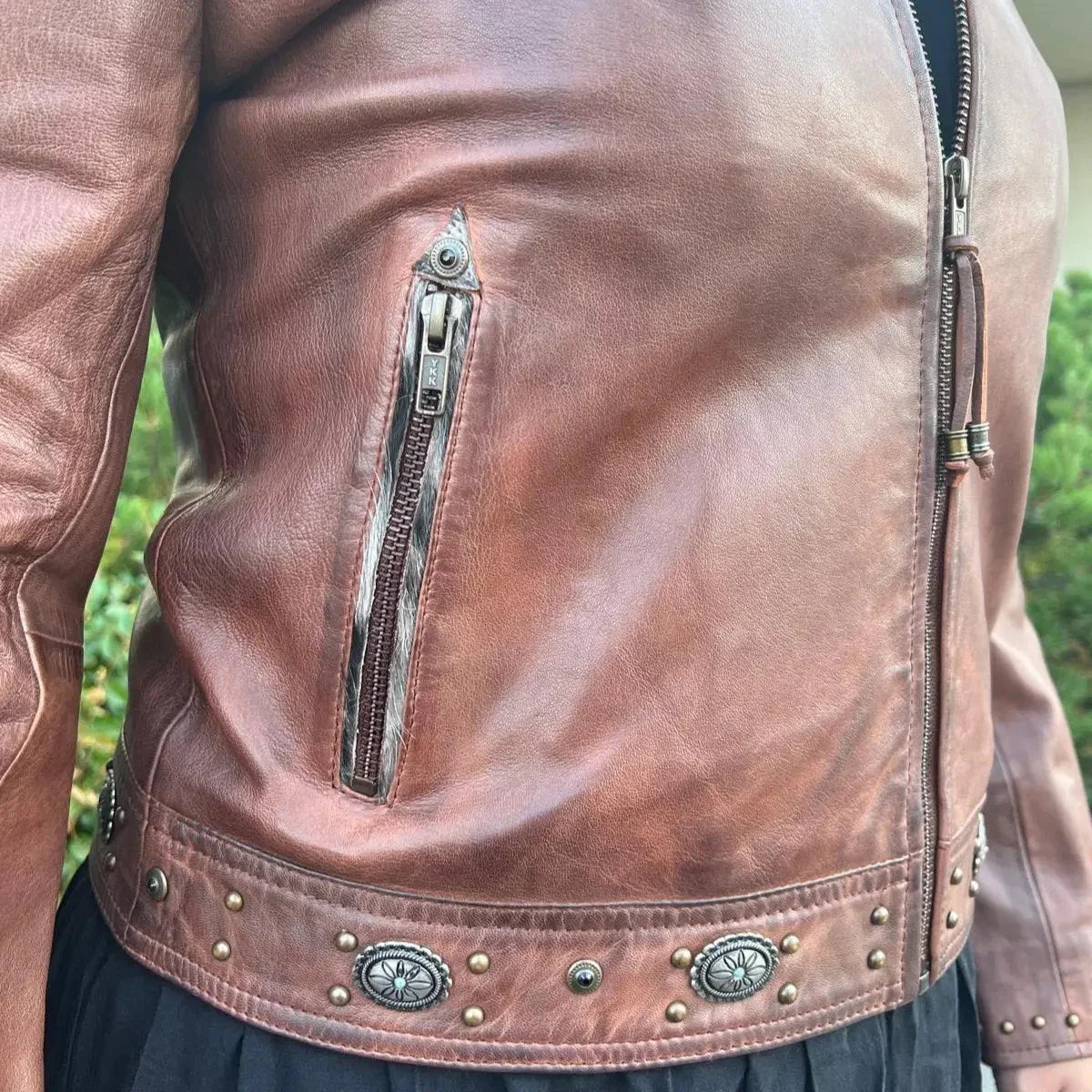 Brown leather western jacket with zipper pocket and studded concho details for women