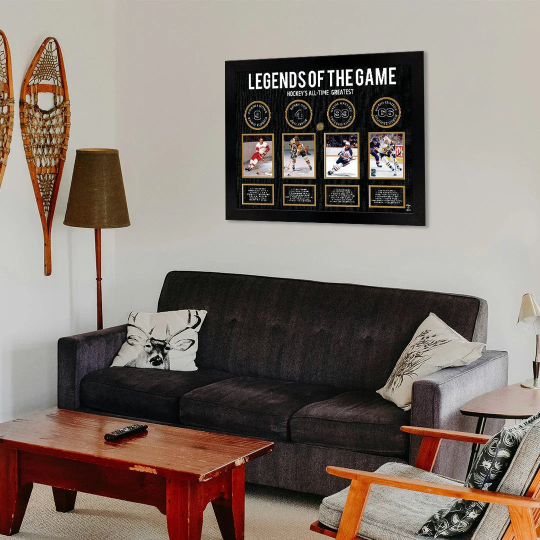 Living room with a dark sofa, wooden coffee table, and a hockey legends wall art display