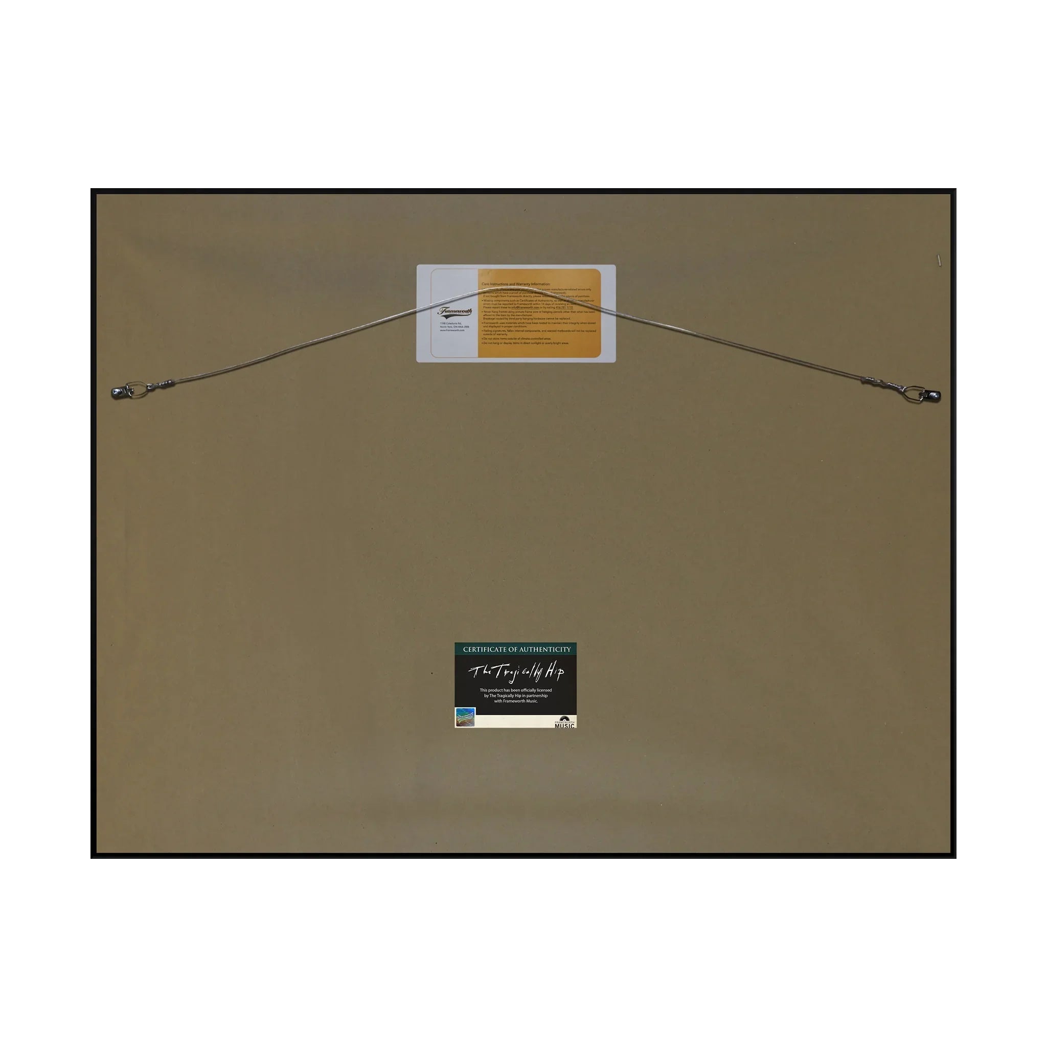 Back of framed artwork with hanging wire and certificate of authenticity