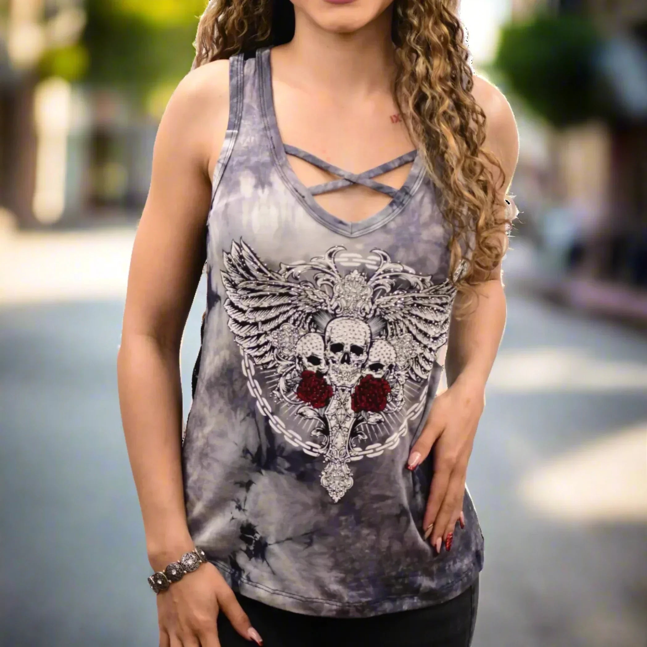 Woman wearing tie-dye chain link skulls graphic tank top outdoors