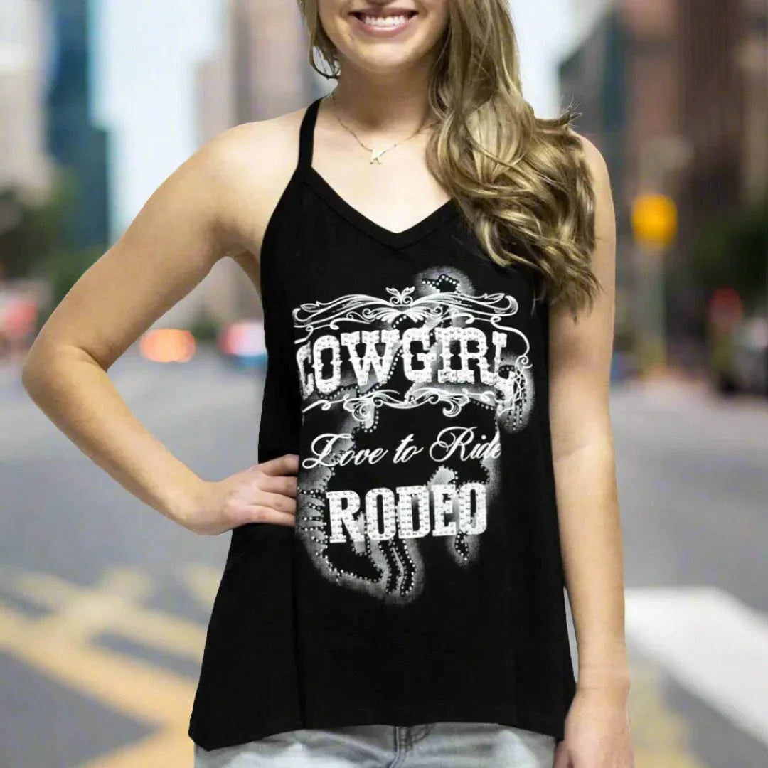Woman wearing Liberty Wear women's cowgirl rodeo tank top with white graphic text on street