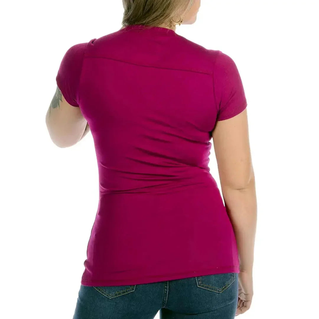Woman wearing magenta Liberty Wear Spitfire T-shirt and blue jeans, back view