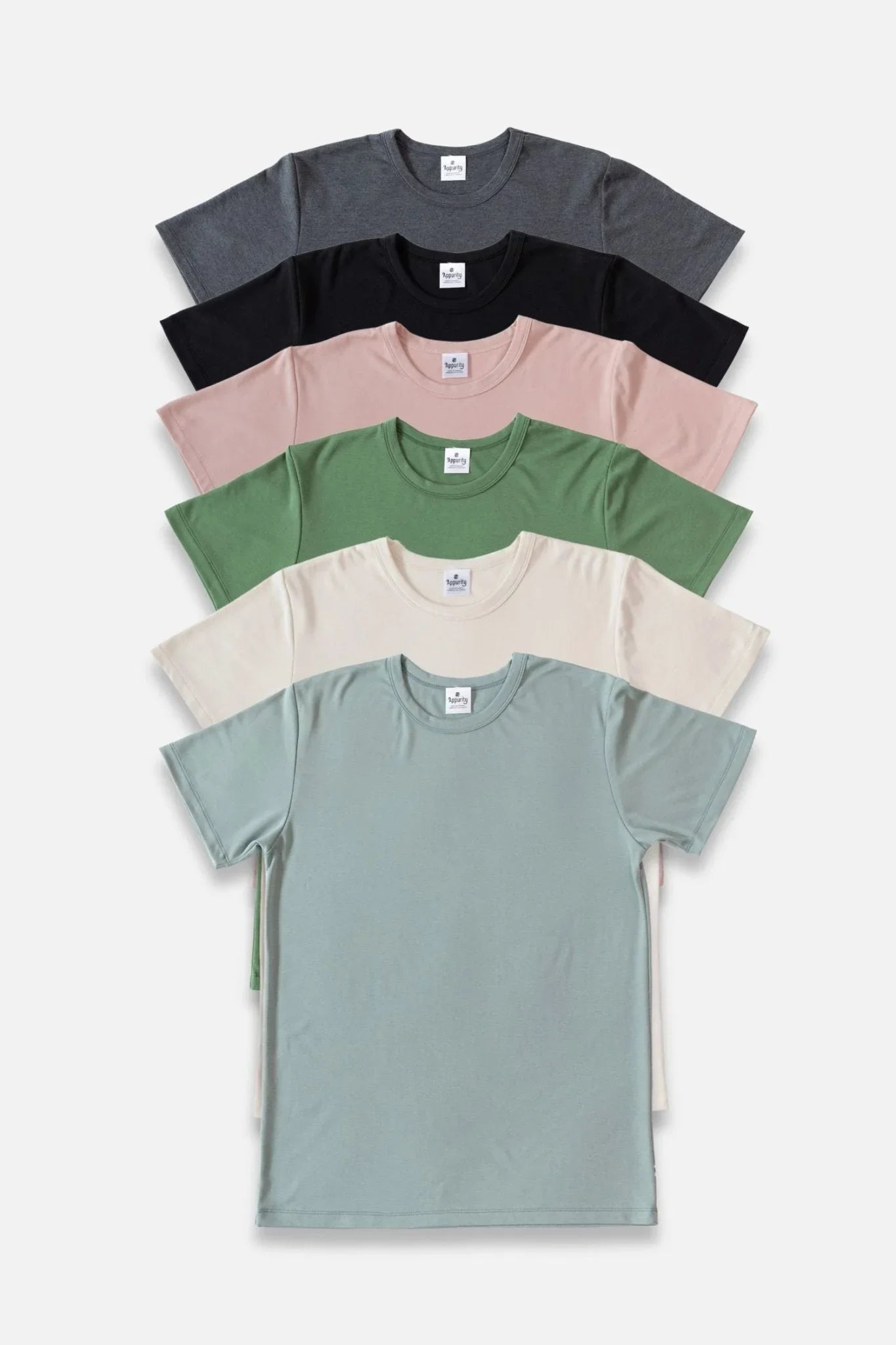 Stack of men's bamboo t-shirts in assorted colors on a plain background.