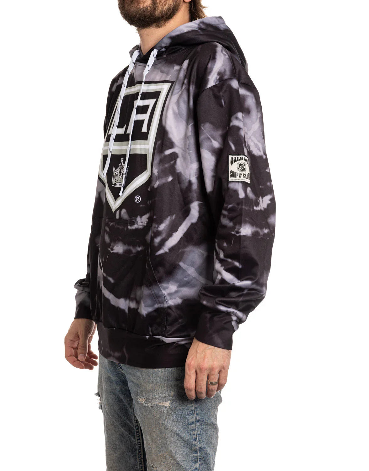 Man wearing black and white tie-dye LA Kings sublimation hoodie with front logo
