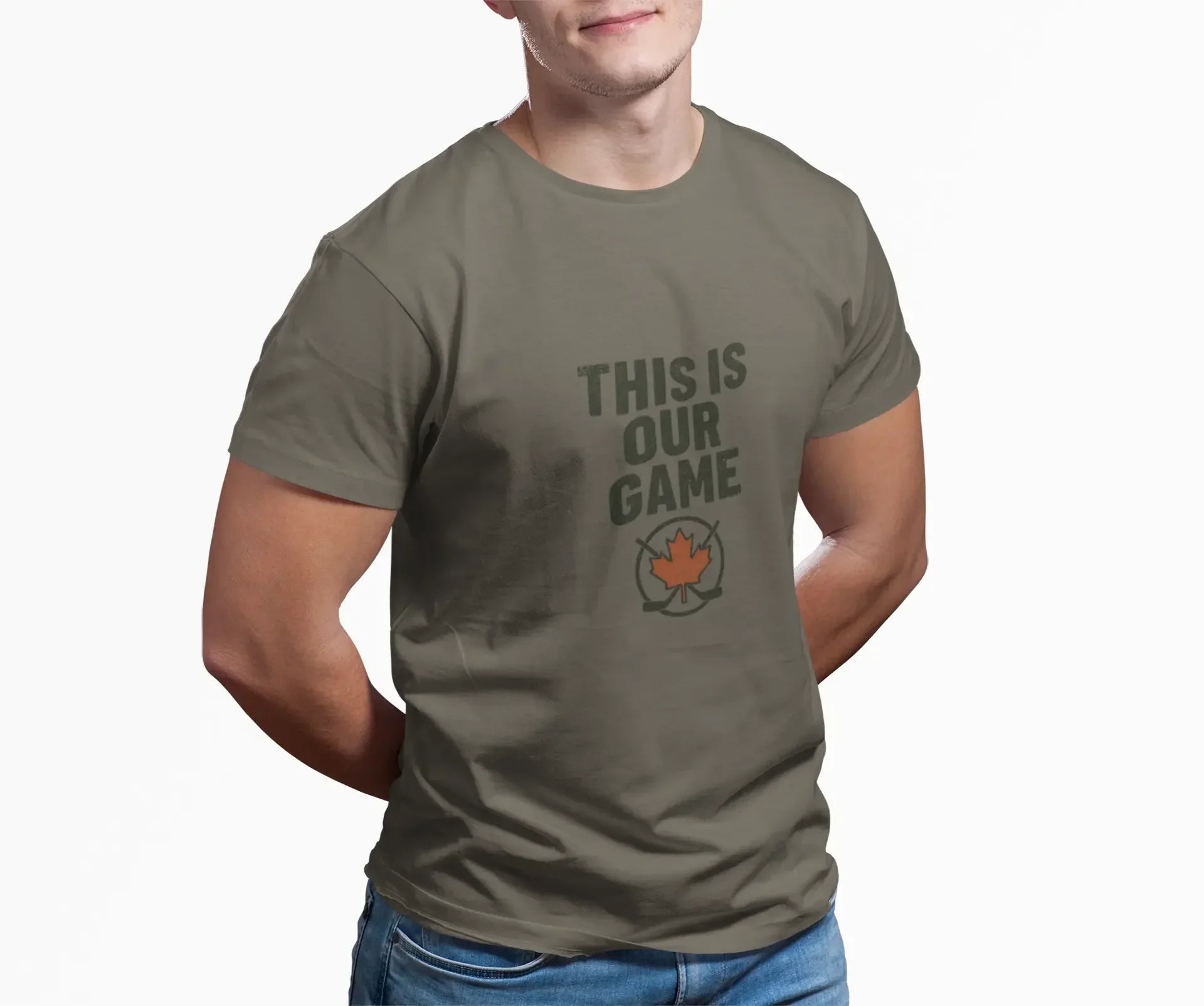 Man wearing olive green t-shirt with 'THIS IS OUR GAME' and maple leaf hockey logo.