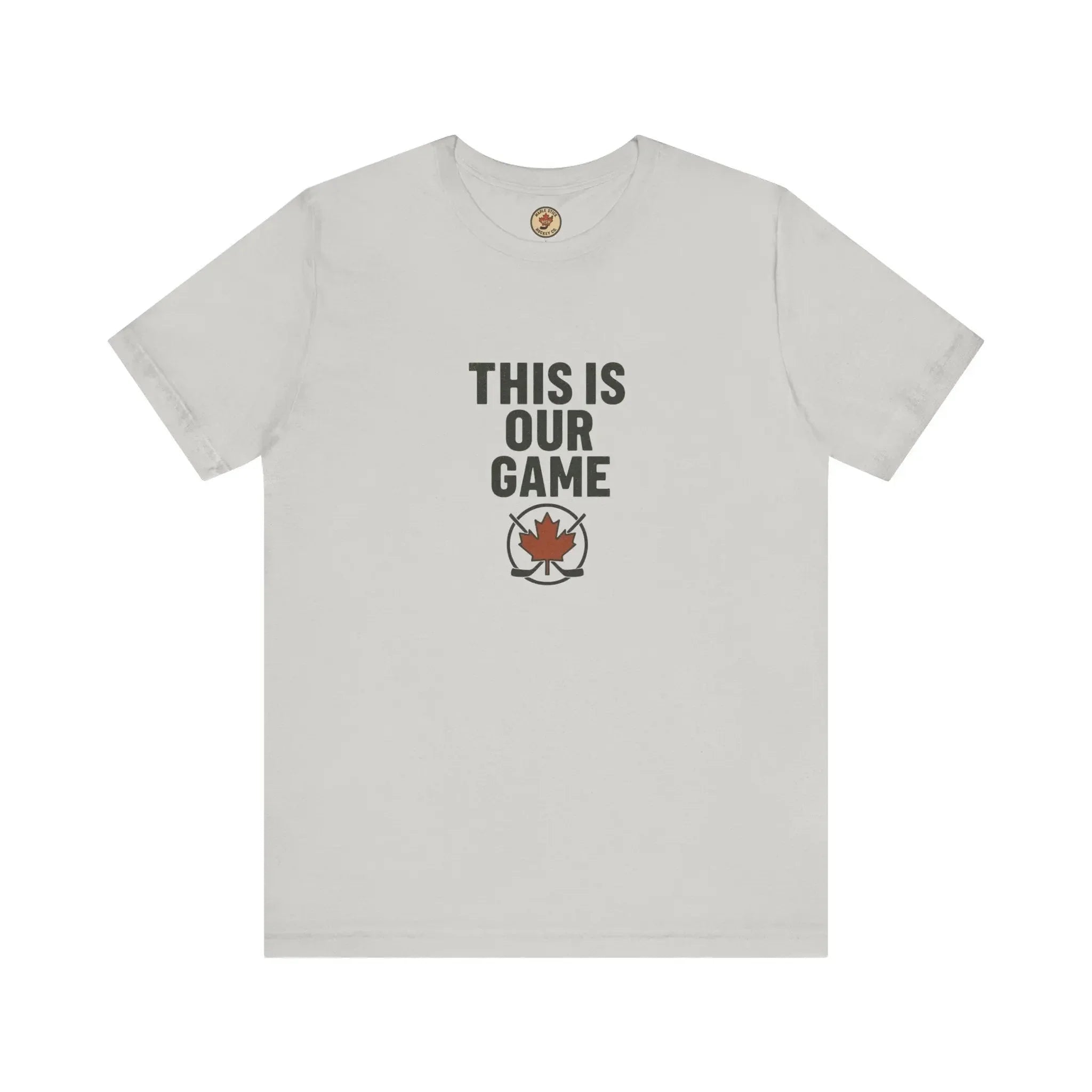 White t-shirt with 'THIS IS OUR GAME' text and maple leaf hockey logo on front
