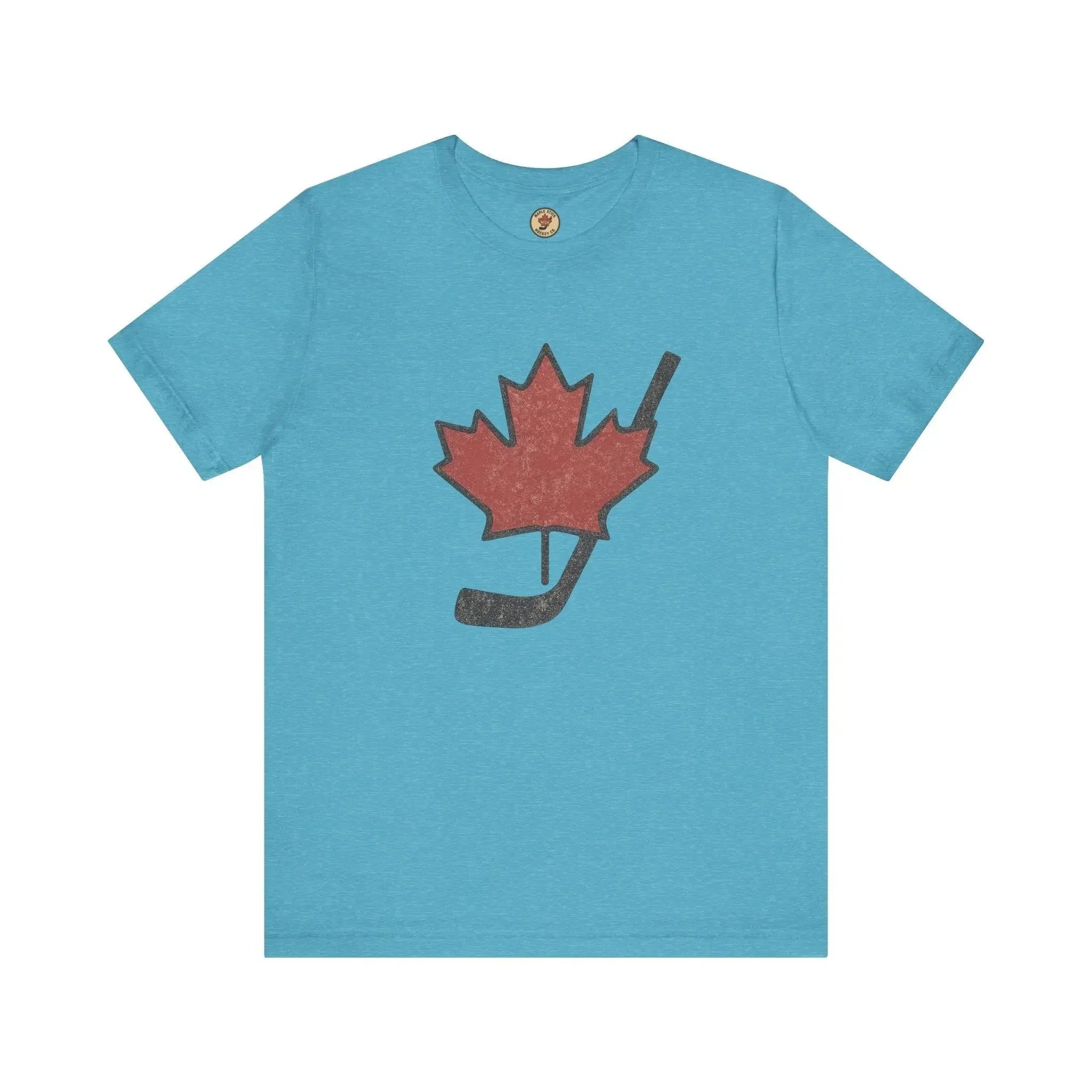 Blue t-shirt with red maple leaf and black hockey stick graphic on front