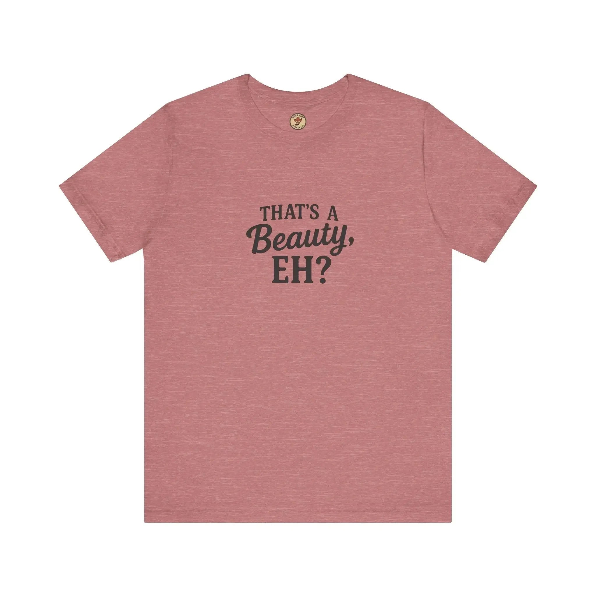 Pink t-shirt with black text that says 'That's a Beauty, EH?' on the front