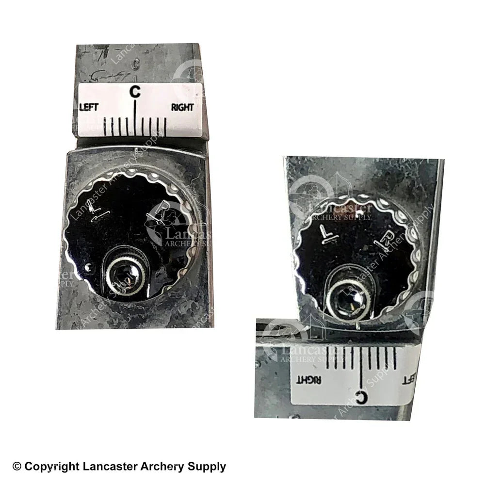 Close-up of metal bow sight adjustment knobs with engraved markings and left-right scale.