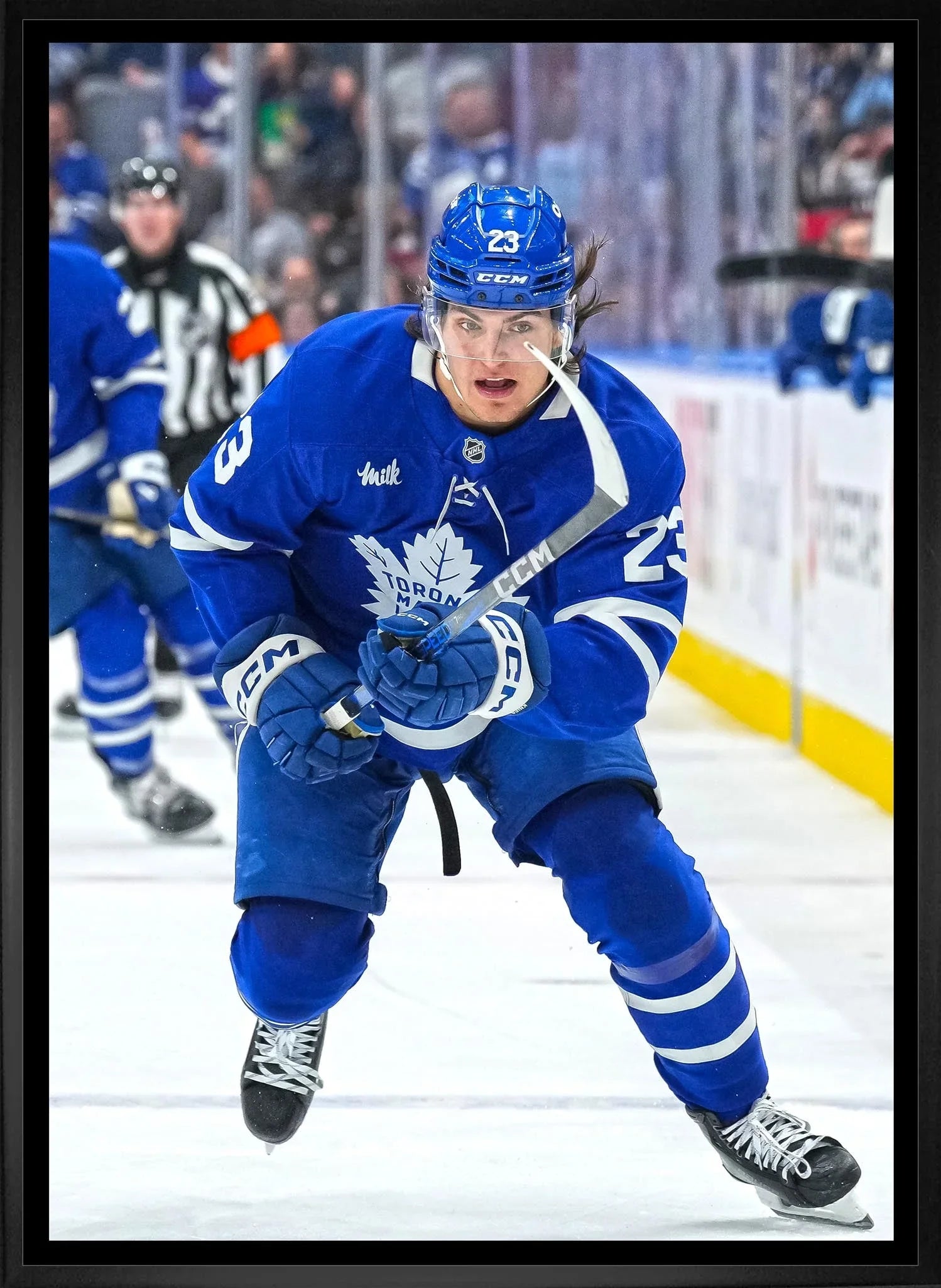 Toronto Maple Leafs player number 23 skating on ice during NHL hockey game