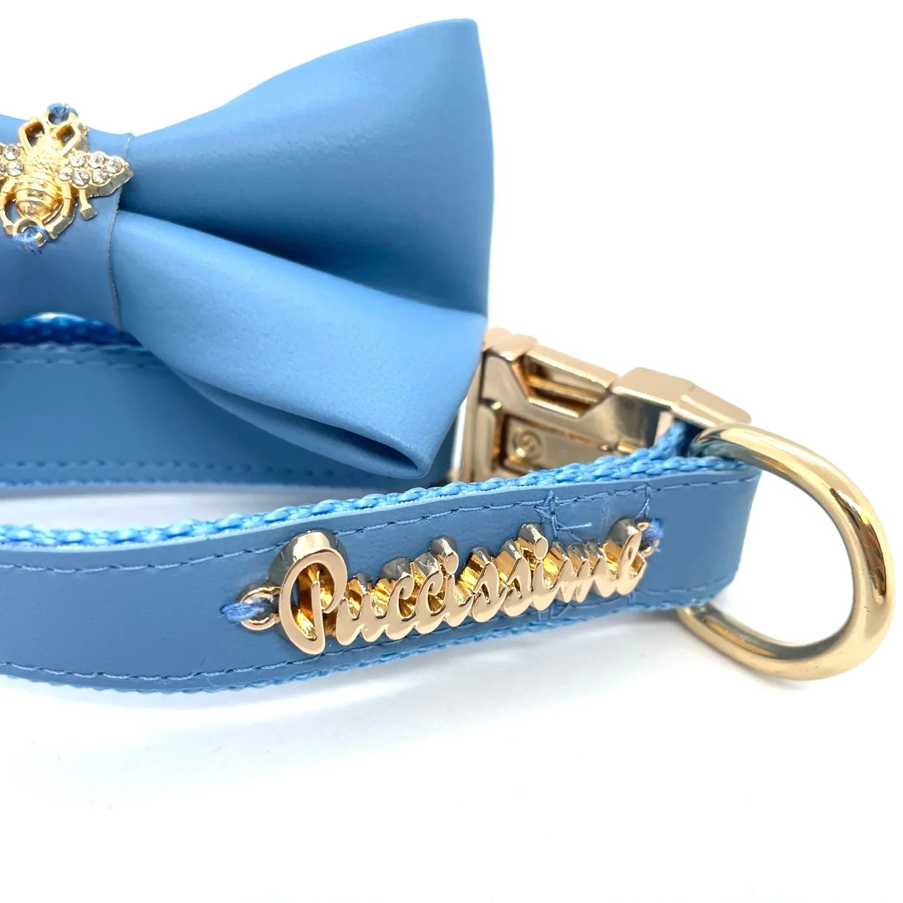 Blue dog collar with gold hardware, blue bow, jeweled bee charm, Puccissima branding