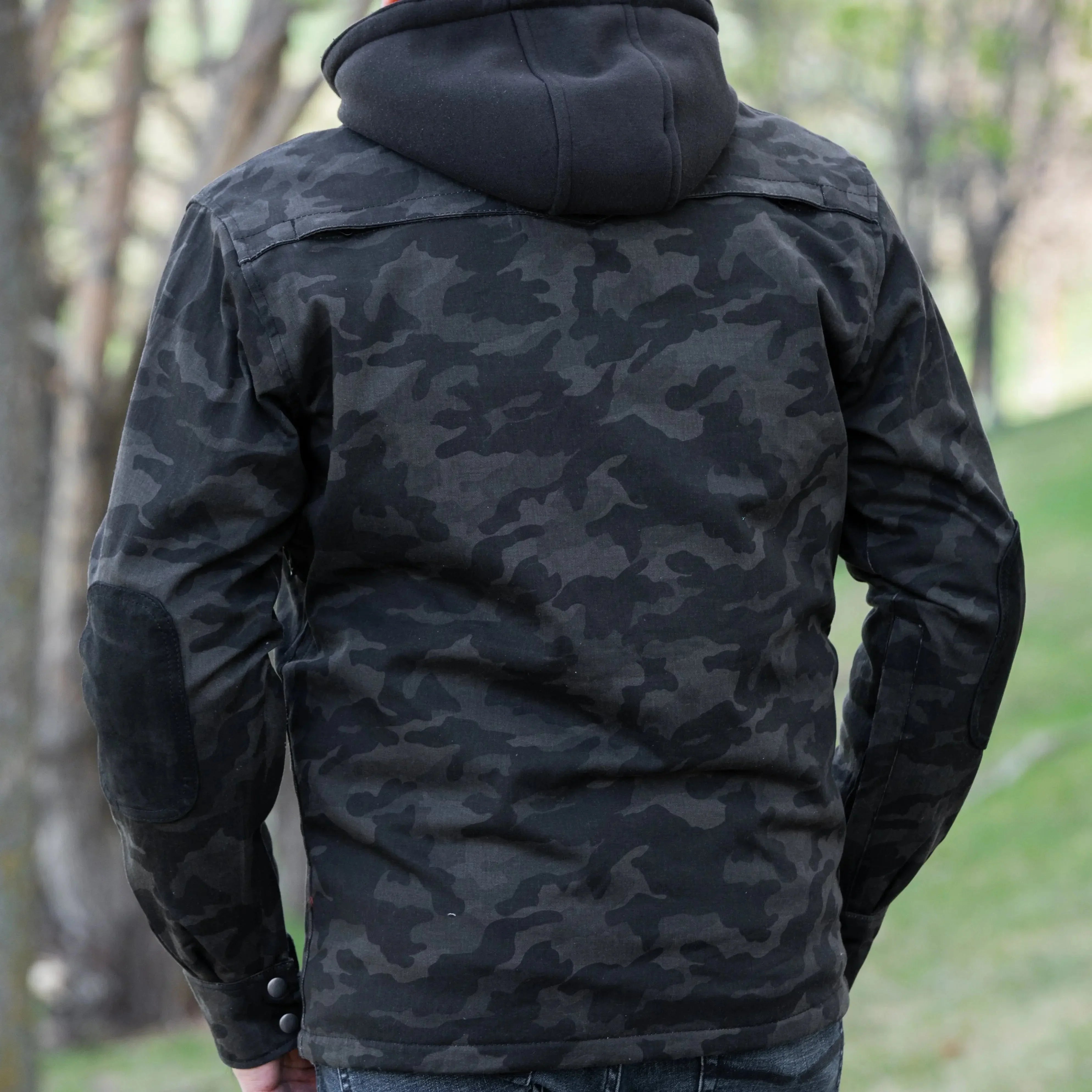 Man wearing black camo armored biker shirt with extra protection outdoors