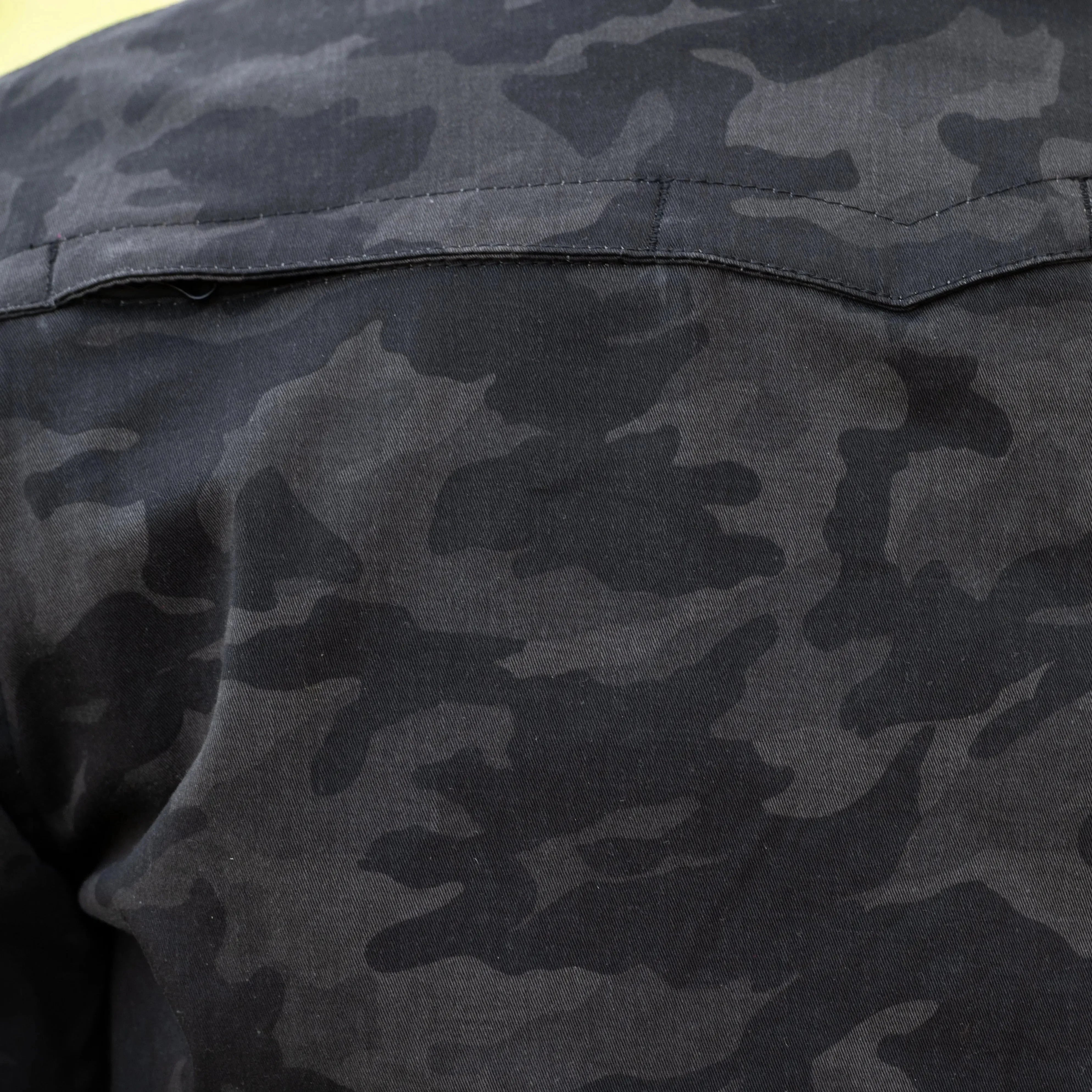 Close-up of men's black camo armored biker shirt with protective fabric detail