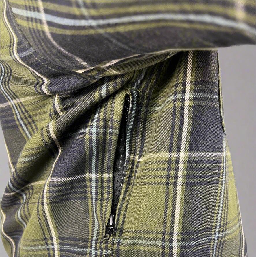 Close-up of green plaid flannel shirt with side zipper pocket detail